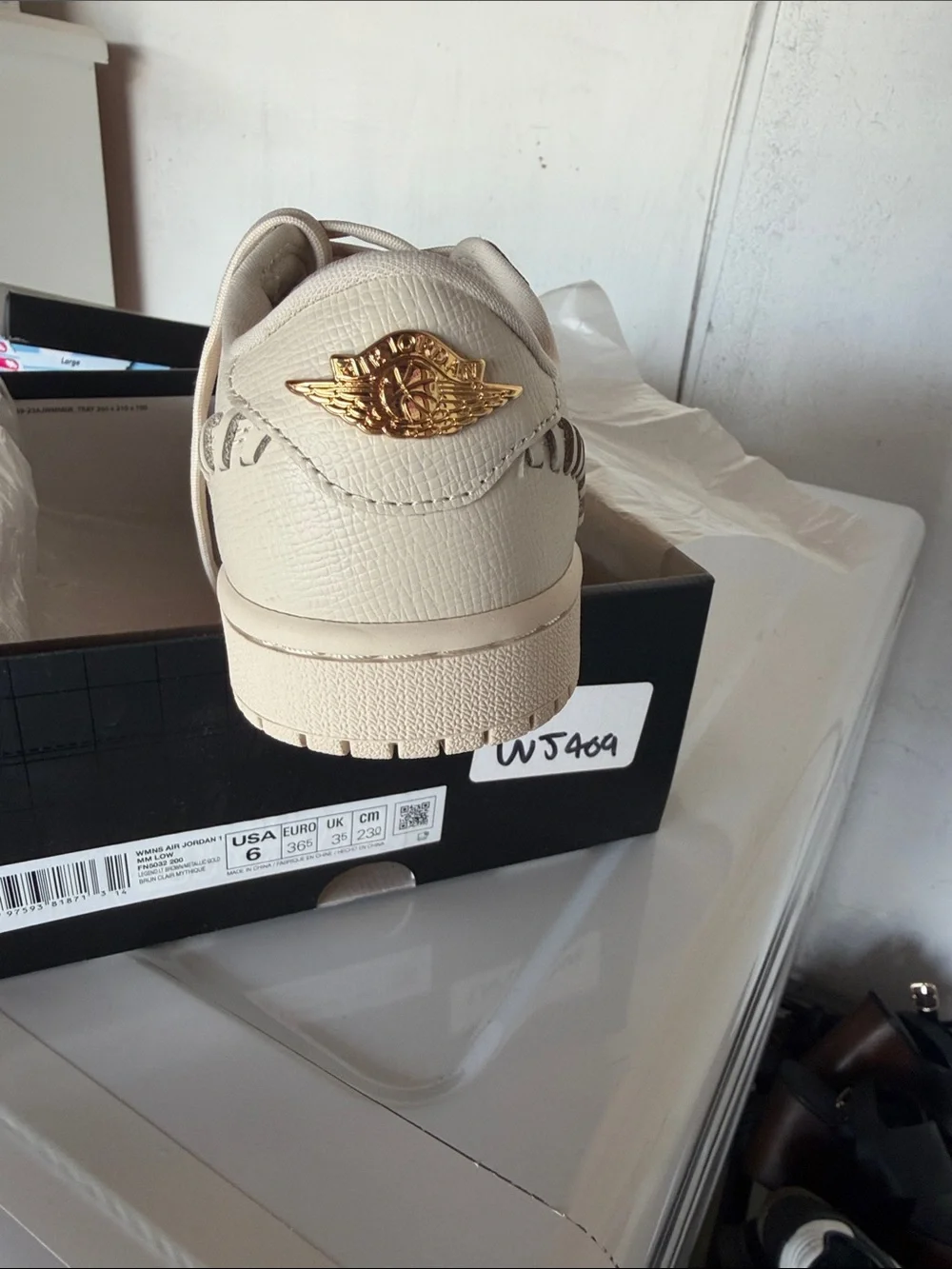 Nike Men’s Tan Low-Top Sneakers with Gold Swoosh